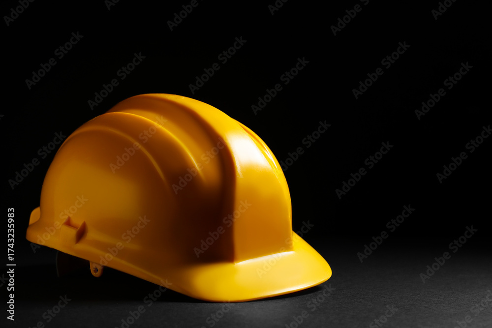Fototapeta premium Hardhat on black background, closeup