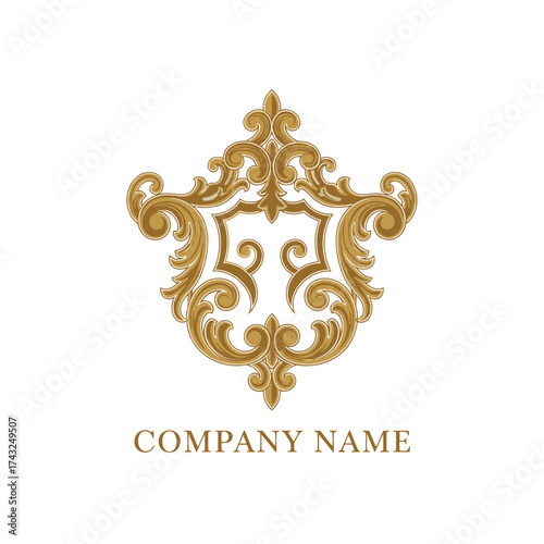 Ornate Golden Emblem with Intricate Baroque Scrolls and Flourishes.