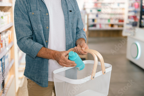 Unrecognizable man buying drugs in pharmacy