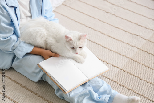 Little boy with cat and boo...