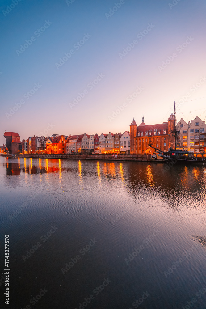 Obraz premium Gdansk with Motlawa river in Poland. Old town colourful house with Stragania Gate