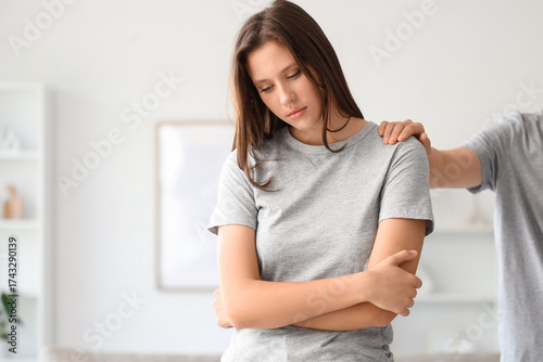 Young woman supporting her ...