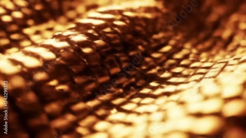 Abstract golden texture with repeating pattern and highlights with closeup shot.