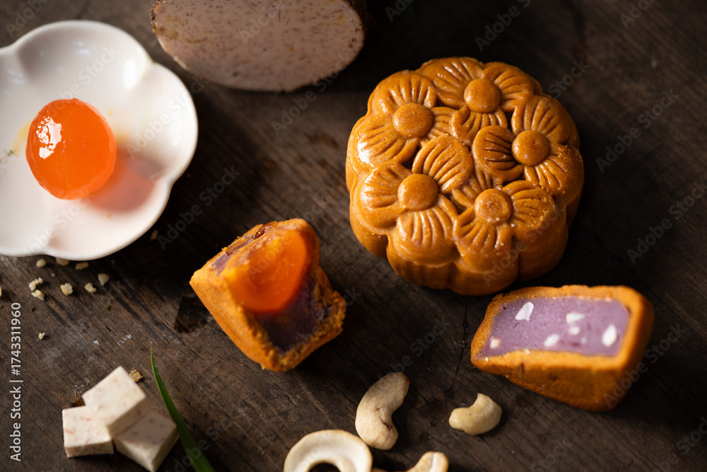 Fototapeta premium Taro mooncake with salted egg yolk and cashew nuts