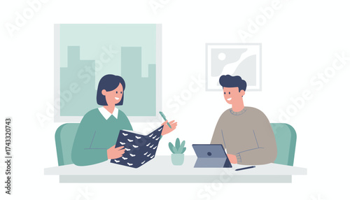 Smiling colleagues collaborate sharing ideas with a book and digital tablet in a modern office