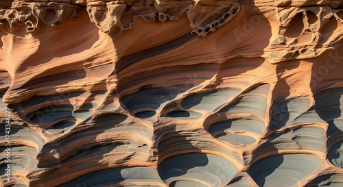 Stunning sandstone formations create a mesmerizing natural abstract with swirling patterns and textures, perfect for travel, nature, and geological themes