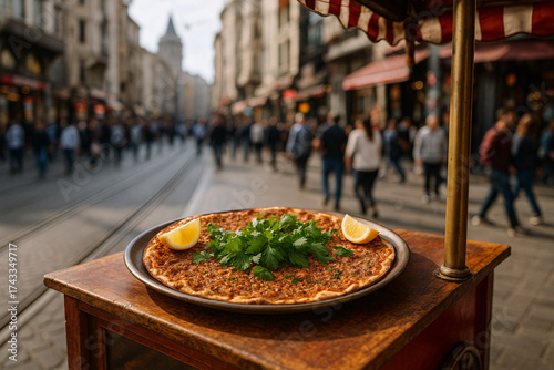 Freshly Baked Lahmacun with Herbs and Lemon on a Traditional Street Food Stall in Istanbul