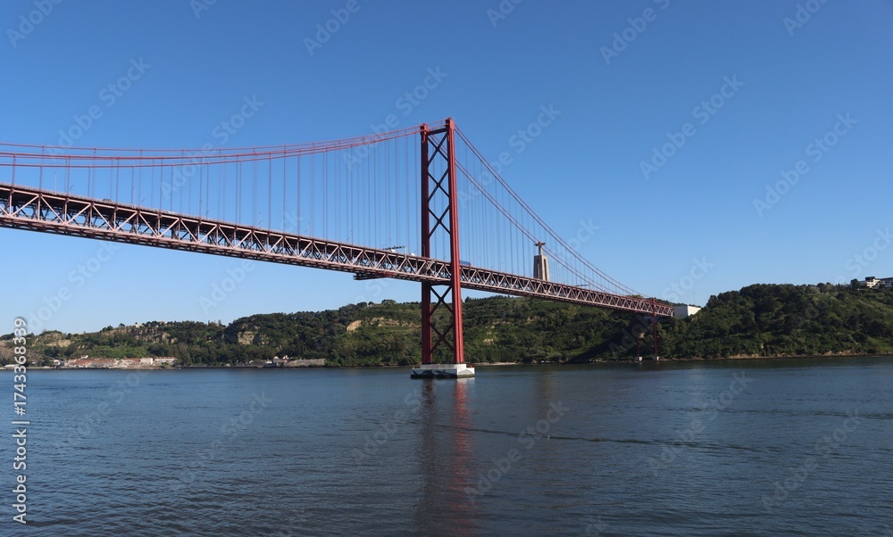 Fototapeta premium The 25th April Bridge crossing the Tagus River in Lisbon, Portugal.