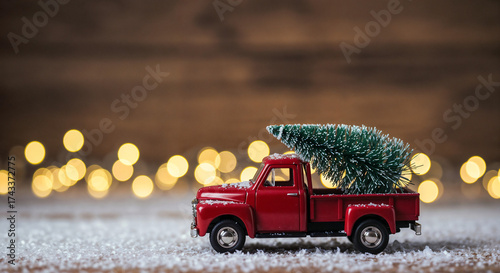 A toy pickup truck is carrying a Christmas tree. . Generative AI