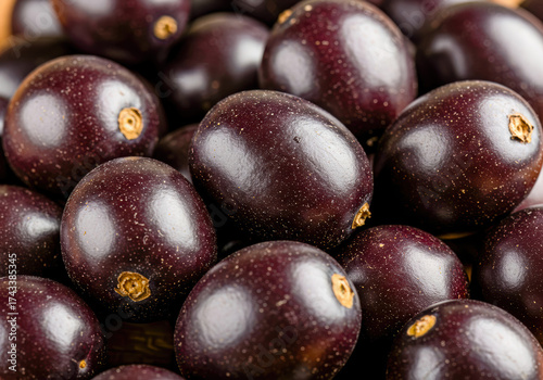 Wallpaper Mural A vibrant close-up of numerous ripe, purple Jamun fruits, also known as Java plums, displaying their characteristic dusty bloom. Torontodigital.ca