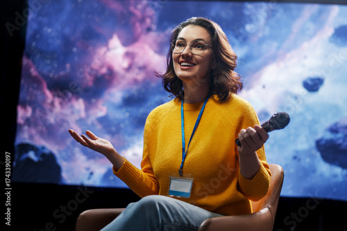 woman is giving a presentation at conference