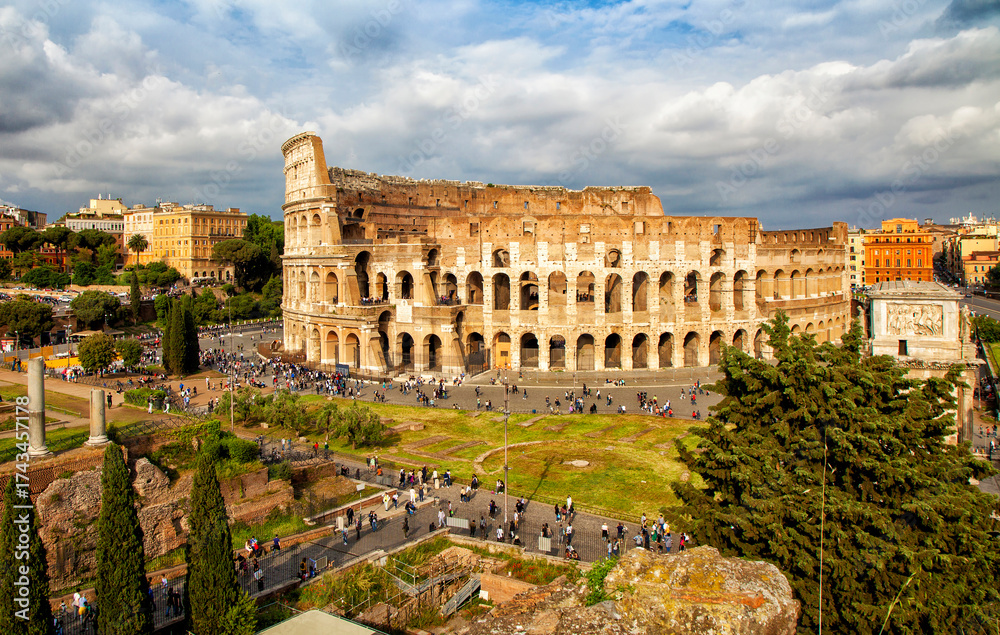 Fototapeta premium Colosseum, Rome, Italy. Colosseum is one of the main attractions of Rome. Amphitheatre in the centre of the city of Rome, Italy. Rome architecture and landmark.
