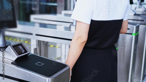 Woman holding mobile phone scanning enters checkpoint, slow motion video