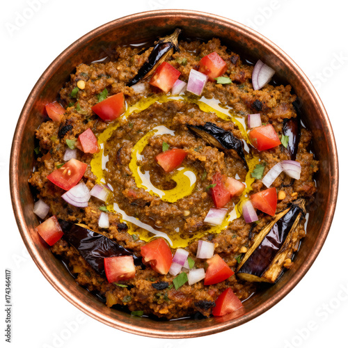 Gourmet Indian Baingan Bharta, a vegetarian roasted eggplant dish in a bronze bowl, top view