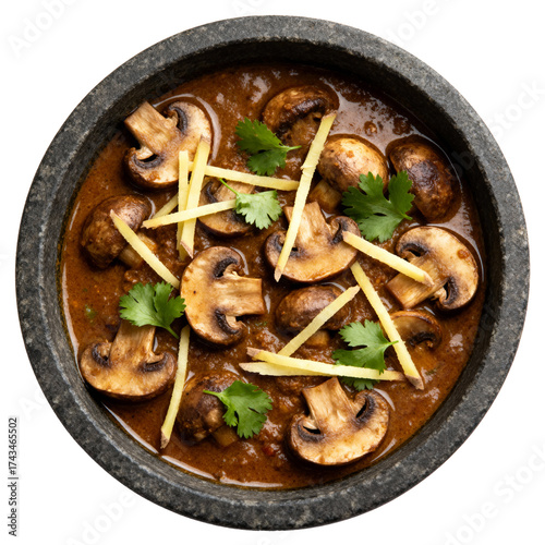Gourmet Indian Mushroom Masala curry in a dark soapstone bowl, a top-down minimalist flat lay
