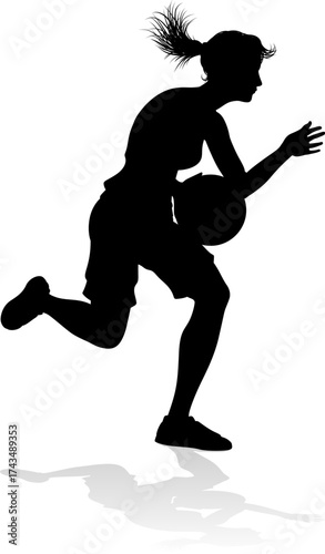 Silhouette of athletic woman female basketball player with basketball ball. Sports concept.