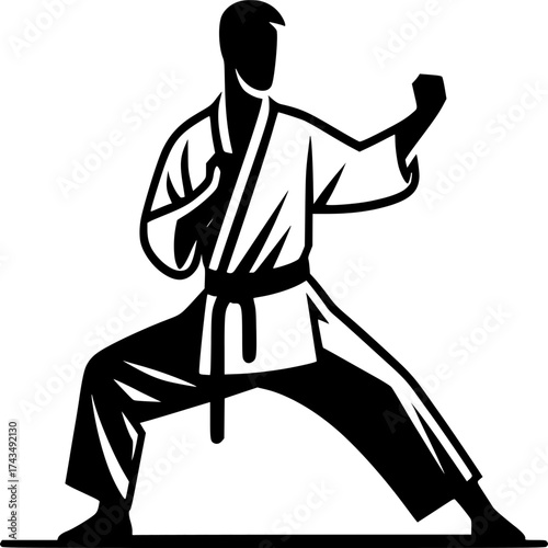 Karate Master in Action: A focused Karate master, dressed in a traditional uniform, demonstrates a powerful stance, epitomizing discipline and martial arts prowess.