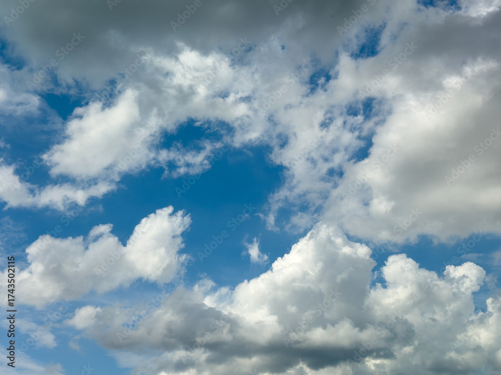 Obraz premium Dynamic Blue Sky White Grey Clouds Background