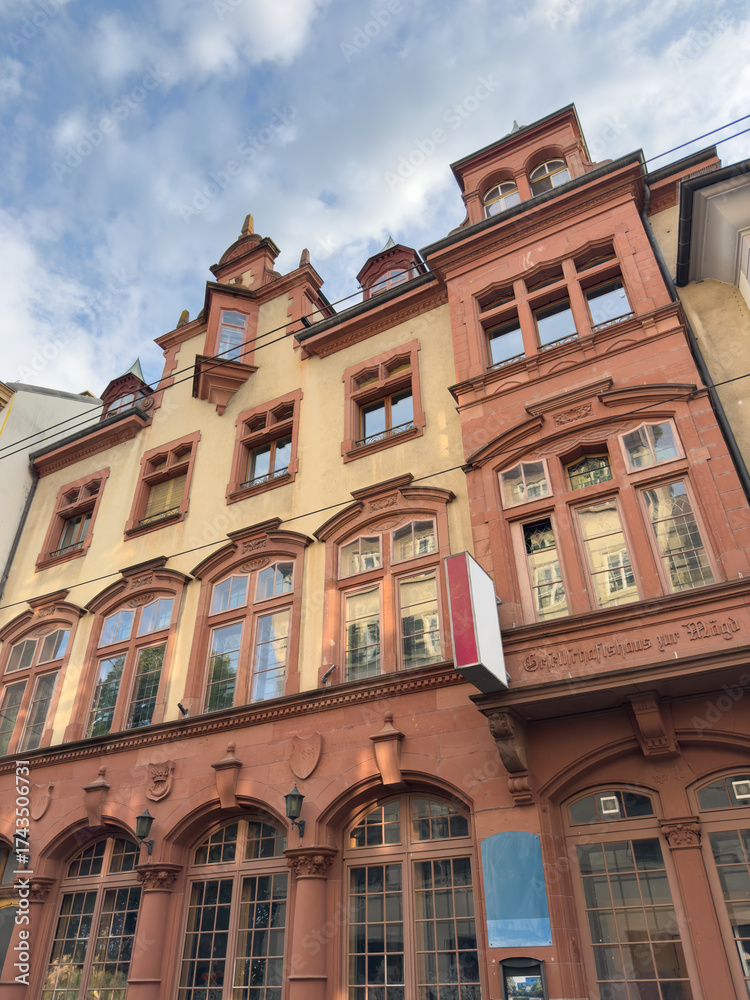 Naklejka premium Low Angle Historic Red Facade European Building