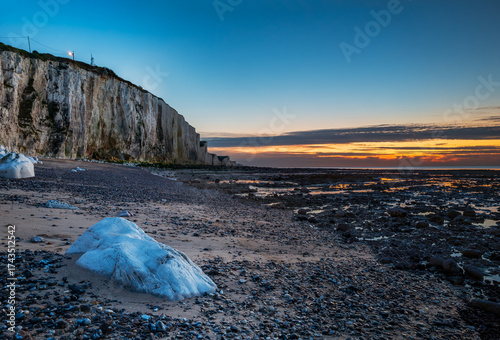 The pebble beach and the cliffs of Ault at sunset, alabaster coast, department of Seine Maritime, Normandy region, France.