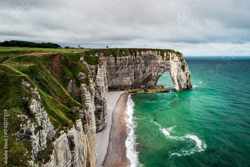 The Manneporte Cliff, natural rock arch and beach of the alabaster coast, city of Etretat, department of Seine Maritime, Normandie region, France.