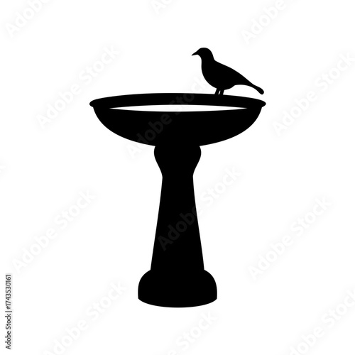 Silhouette of a bird perched on a birdbath against a white background
