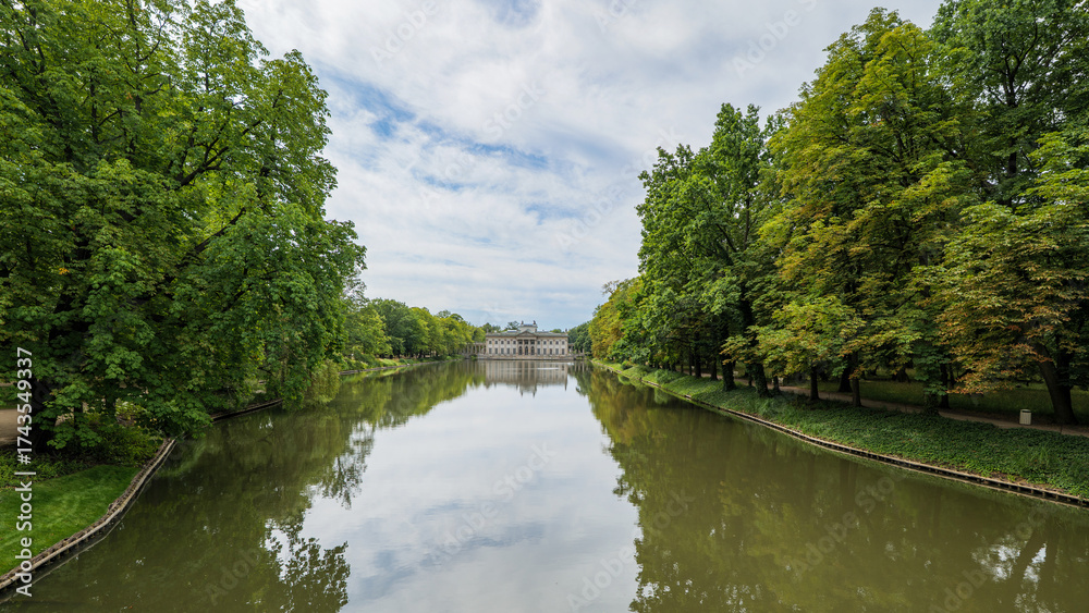 Fototapeta premium The Royal Łazienki Park in Warsaw. The Palace on the Isle. The Baroque Garden Pavilion. The Classicist Palace. The Łazienki Ponds. Beautiful Architecture. Poland