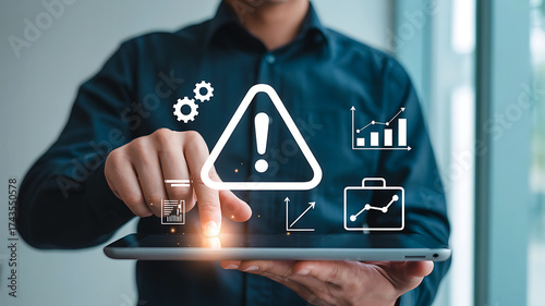 Man holding tablet with digital icons representing risk management and business strategy