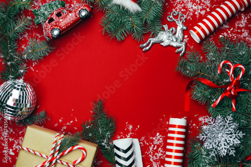 Christmas composition with gifts on a red background.