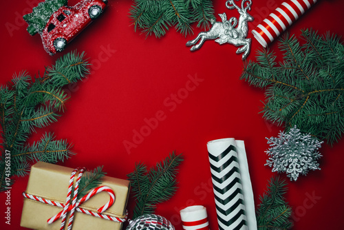 Christmas composition with gifts on a red background.