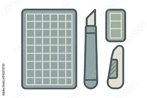 Graphic design and DIY hobby supplies featuring a grid cutting mat and precision utility knife