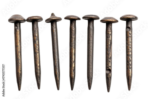 Seven antique rusted iron nails isolated on transparent background. Set of metal nail heads isolated on white background.