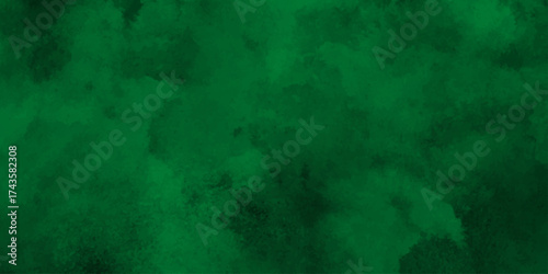 Deep emerald watercolor splash forming a vibrant and textured green abstract background,Dark green watercolor. Emerald green color. Vivid textured aquarelle painted art design background.