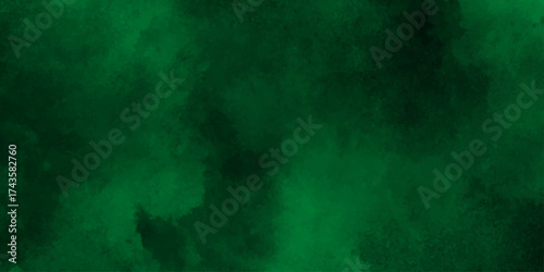 Deep emerald watercolor splash forming a vibrant and textured green abstract background,Dark green watercolor. Emerald green color. Vivid textured aquarelle painted art design background.
