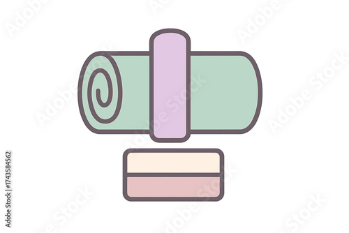 Pastel colored rolled yoga or fitness mat secured with a strap and a rectangular exercise block