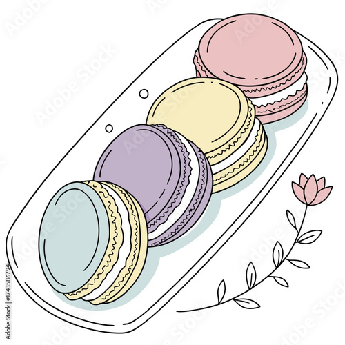 Delicate pastel colored macarons arranged on a white platter with a simple floral illustration on the side