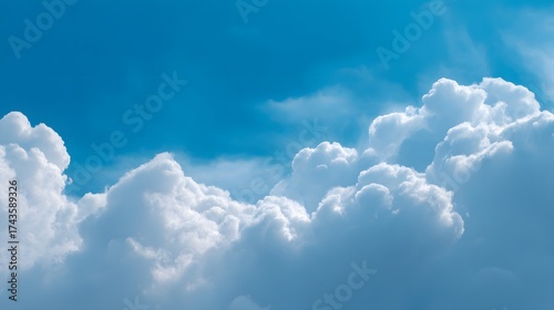 Wallpaper Mural Brilliant fluffy white clouds gracefully drift across a vast, vibrant, and clear cerulean blue sky, creating a breathtaking scene of pure atmospheric beauty under bright, natural daylight. Torontodigital.ca