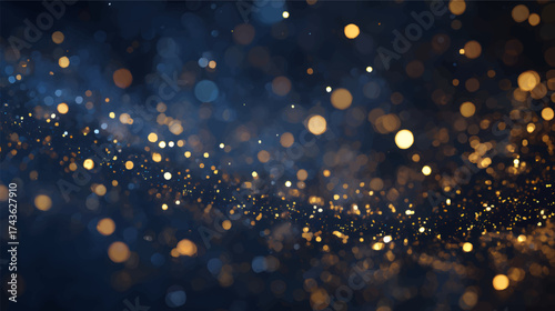 A beautiful abstract background featuring golden and blue bokeh lights, creating a festive and magical atmosphere