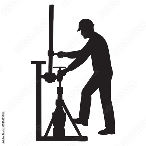 Silhouette of oil field worker operating equipment safety and energy resources industry business concept with hard hat and specialized machinery for drilling and maintenance