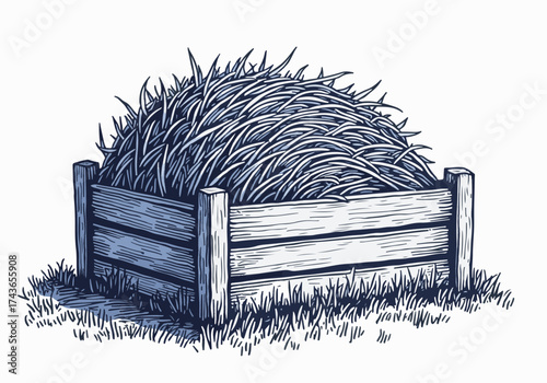 Wooden manger filled with hay, showcasing a rustic winter scene, surrounded by grass, evoking a sense of warmth and comfort during the cold season