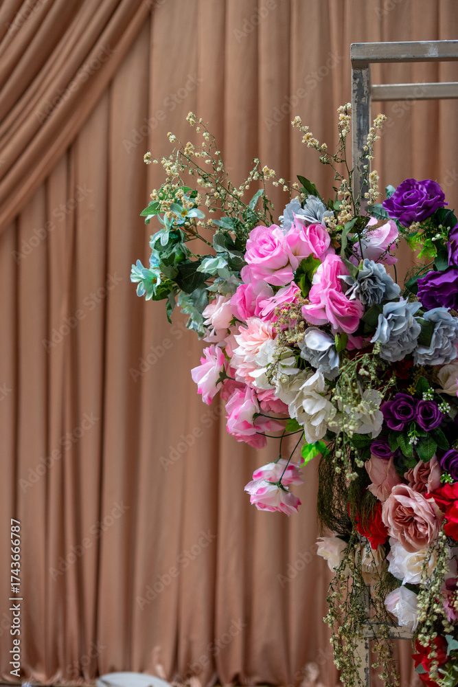 Fototapeta premium Colorful artificial floral arrangement for event decor