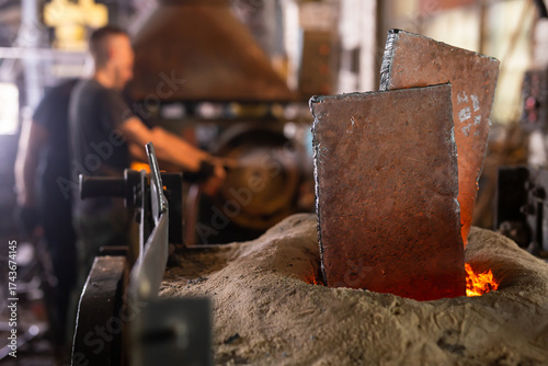 Ferrous metal billet is melted in an induction furnace closeup