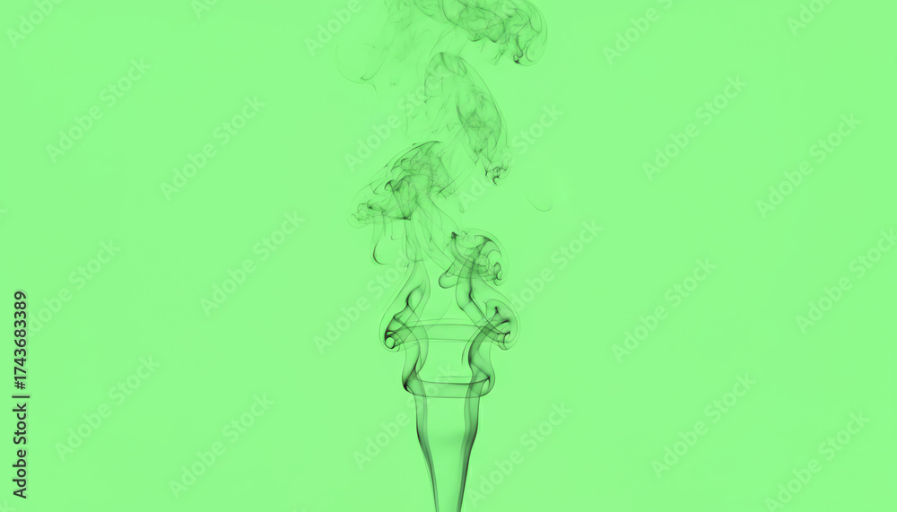 Fototapeta premium A vibrant image of smoke swirling above a unique glass, set against a striking green background, perfect for creative projects.