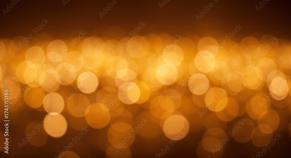 Fototapeta premium Abstract blurred golden lights bokeh background, festive and warm atmosphere