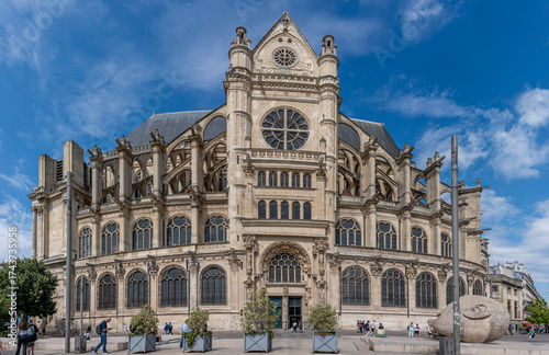 Paris, France - 08 23 2025: Panoramic view of the facade of Church Saint-Eustache from Nelson Mandela Garden