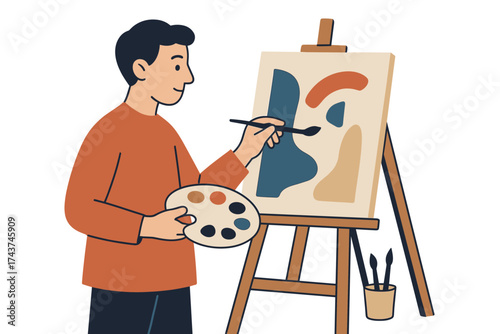 Man painting abstract art on canvas in studio setting