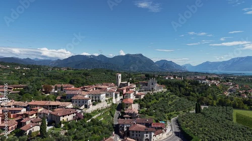 Wallpaper Mural Aerial Italy: Castello di Polpenazze, historic medieval fortress and church on Lake Garda, captured in cinematic drone footage for travel and tourism. Torontodigital.ca