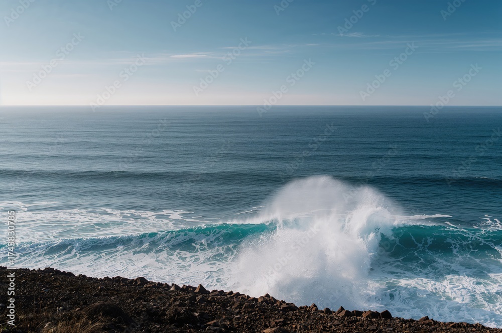 Fototapeta premium Solitary wave crashing onto the shoreline