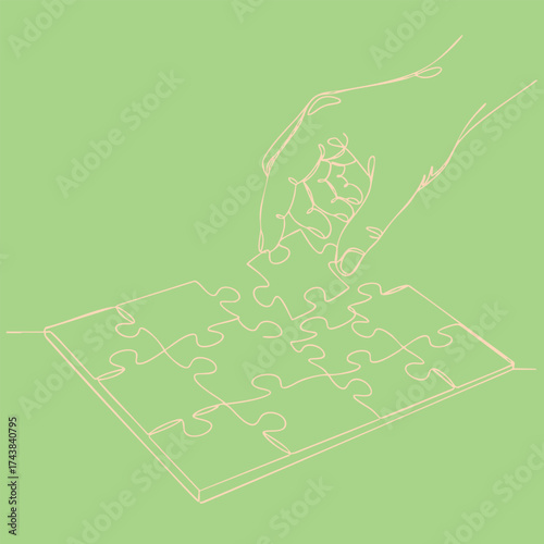 Close-up of a hand assembling a jigsaw puzzle on a pastel green , emphasizing concentration and problem-solving skills