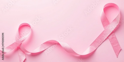 Delicate Pink Ribbons Arranged on a Soft Pink Background, Symbolic of Support and Awareness